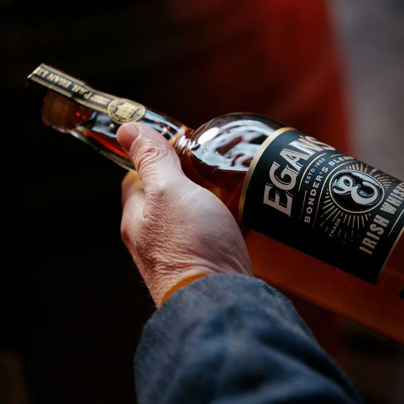 Egan's whiskey bottle held in hand